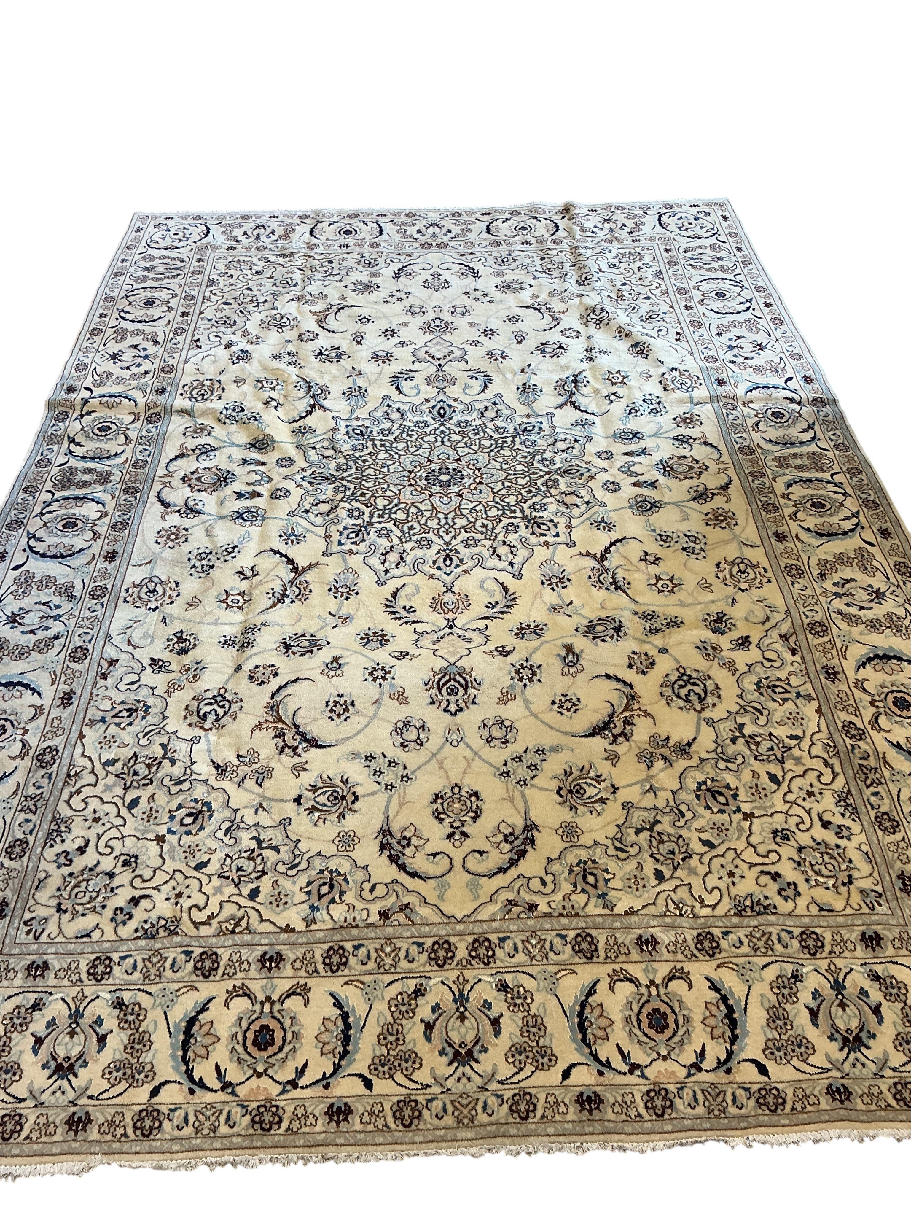An ivory ground Nain carpet, 300cm x 206cm